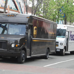 UPS - FedEx trucks delivering packages, packages