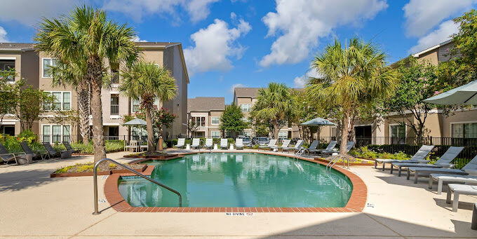 An apartment building and swimming pool.