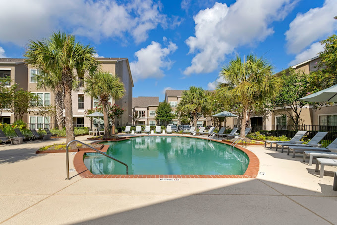 An apartment building and swimming pool.