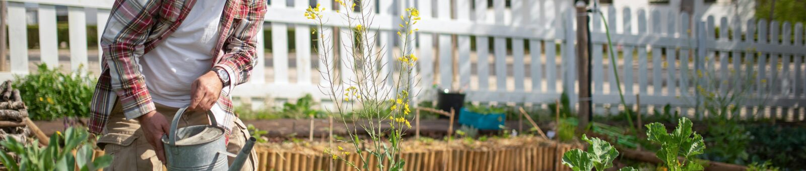 man working in a community garden