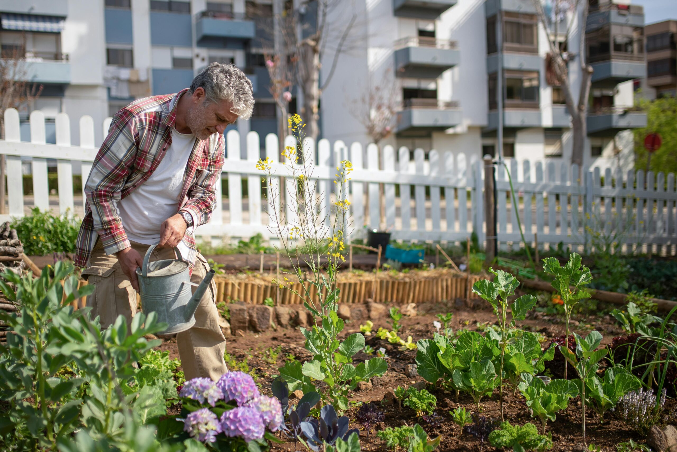 man working in a community garden