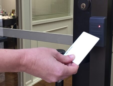 a prox card and reader on a business door