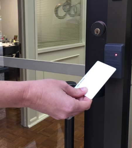a prox card and reader on a business door