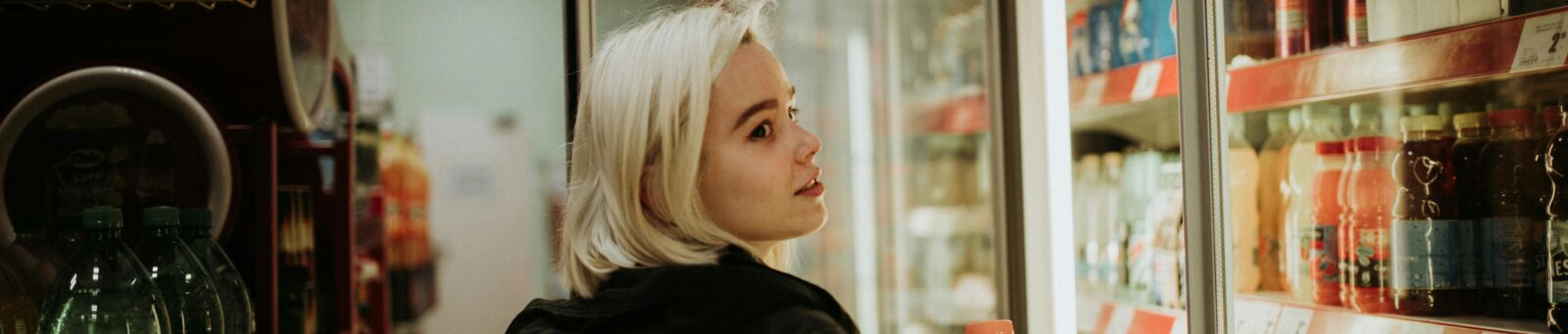 Young blonde woman at grocery store