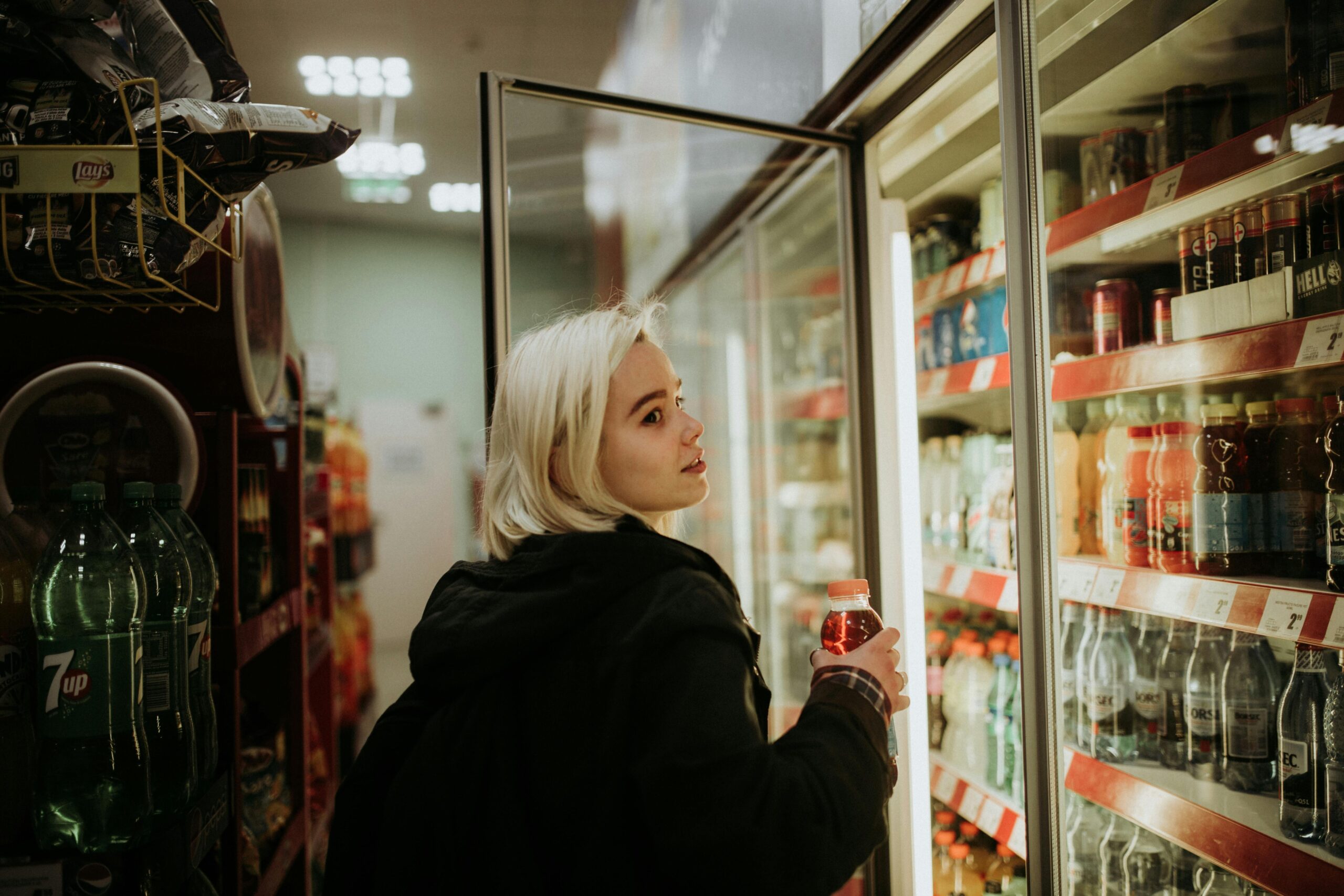 Young blonde woman at grocery store