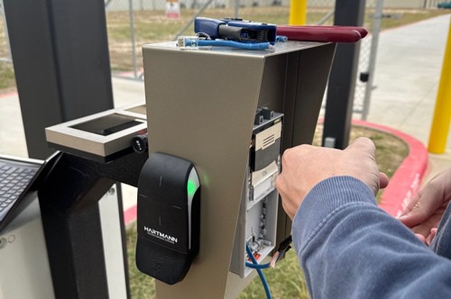 A professional working on an access control system