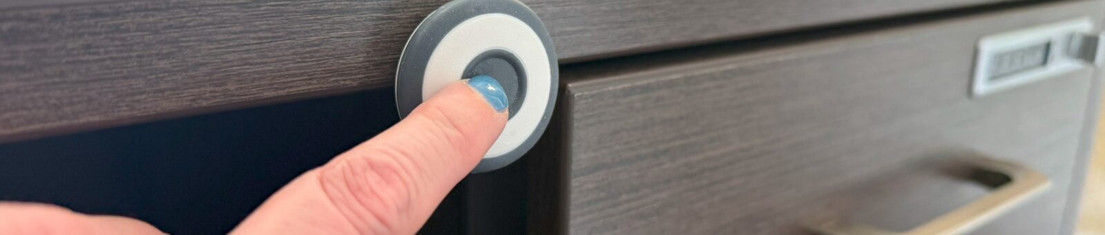 a finger pushing a panic button