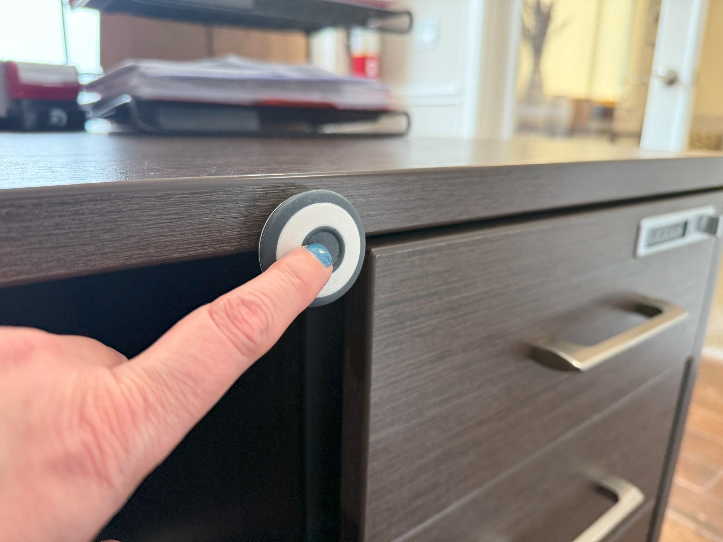 a finger pushing a panic button