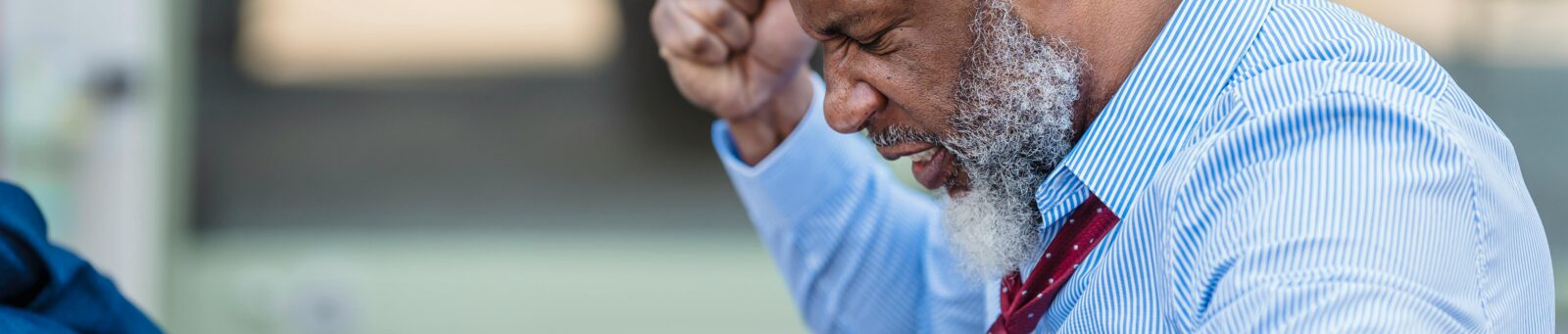 A man frustrated while working on his laptop